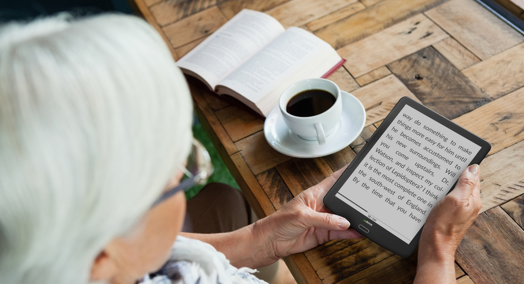 Senior reading on ebook reader with adjust large text on the screen